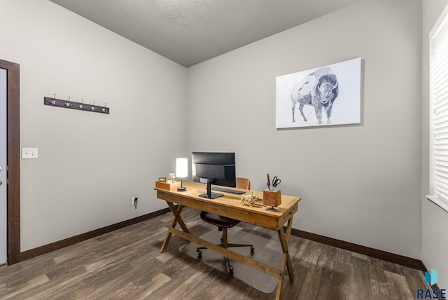 office with dark hardwood / wood-style floors