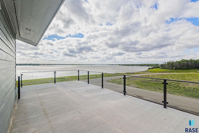 view of patio with a water view