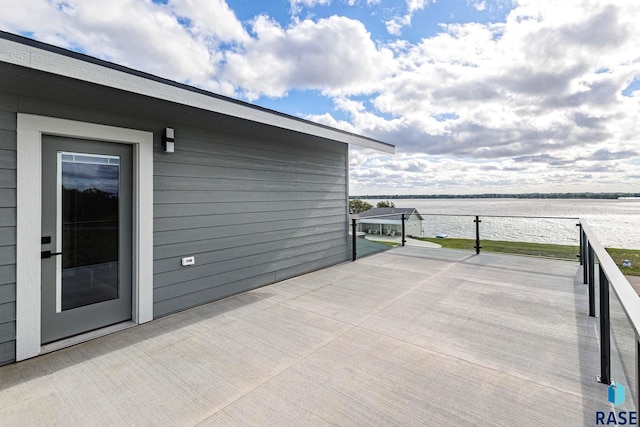 wooden deck with a water view