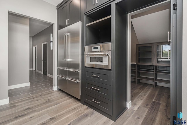 kitchen featuring stainless steel appliances and hardwood / wood-style flooring