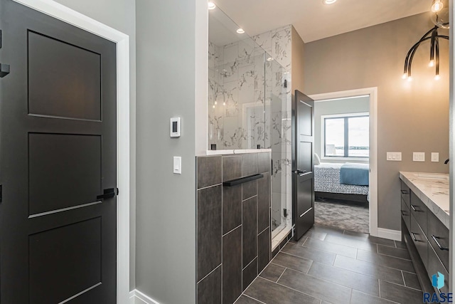 bathroom with vanity and a shower with shower door