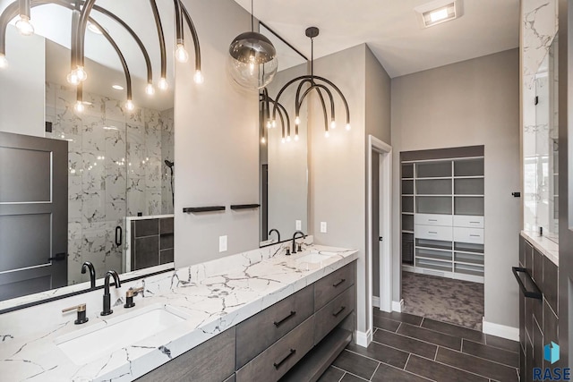 bathroom featuring vanity and an enclosed shower