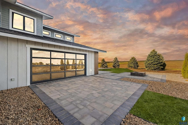 patio terrace at dusk with an outdoor fire pit