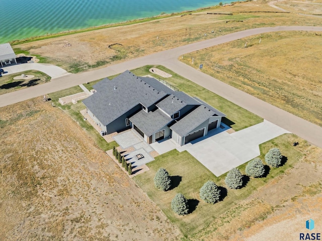 bird's eye view with a rural view and a water view