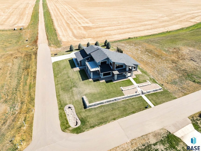 birds eye view of property featuring a rural view