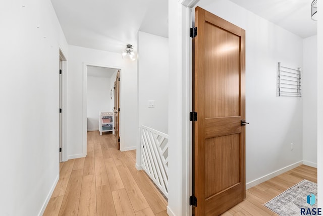 corridor featuring light hardwood / wood-style flooring