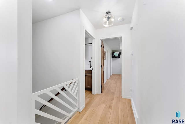 hall with light hardwood / wood-style floors