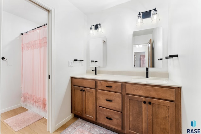 bathroom with vanity and hardwood / wood-style floors