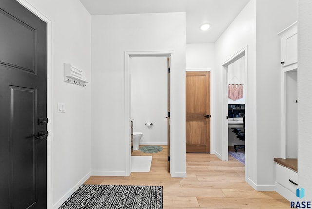 hallway with light wood-type flooring