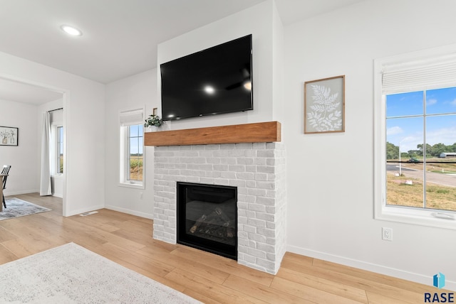 living room featuring hardwood / wood-style floors and a fireplace