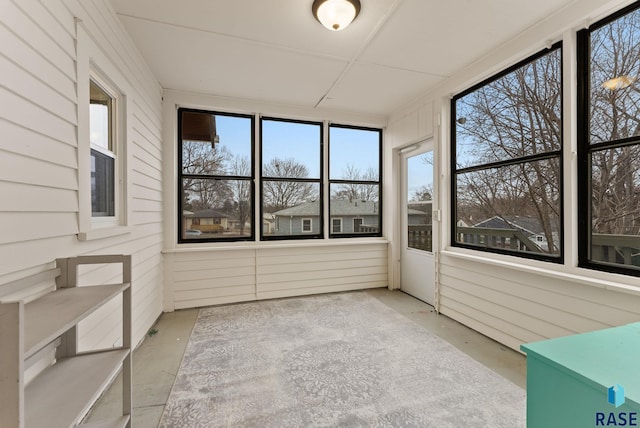 unfurnished sunroom featuring a wealth of natural light