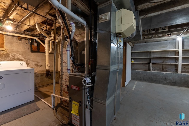 basement featuring washer / clothes dryer and heating unit