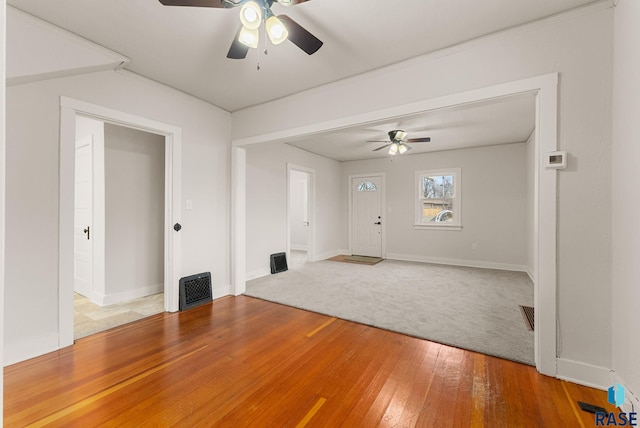 unfurnished room with hardwood / wood-style floors and ceiling fan