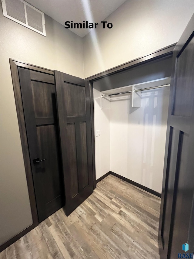 spacious closet with visible vents and light wood-type flooring