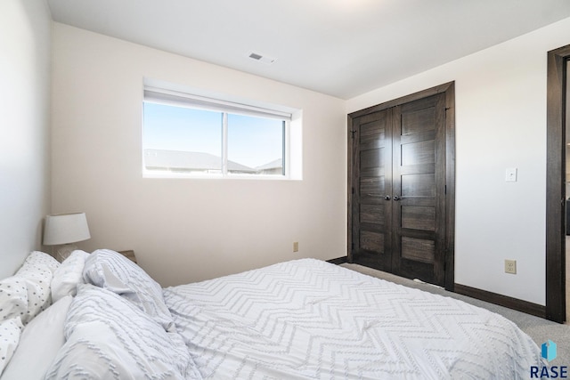 bedroom with light colored carpet