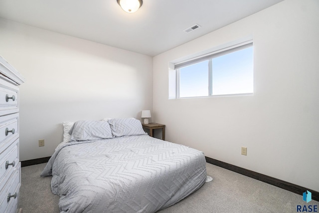 bedroom featuring light colored carpet