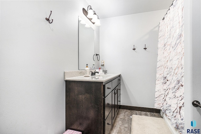 bathroom featuring vanity and wood-type flooring