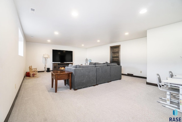 living room featuring light carpet