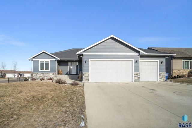 view of front of house featuring a garage and a front yard