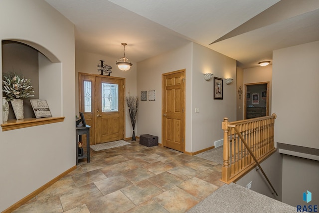 entrance foyer featuring lofted ceiling