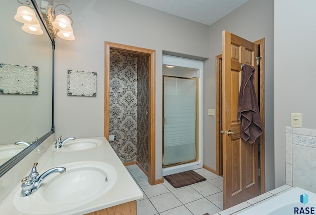 bathroom featuring vanity, tile patterned floors, and a shower with shower door