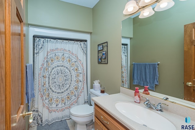 bathroom with vanity, toilet, and tile patterned flooring