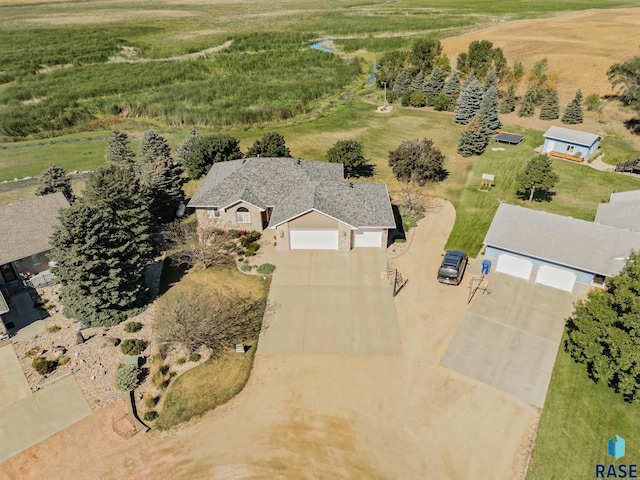 birds eye view of property with a rural view