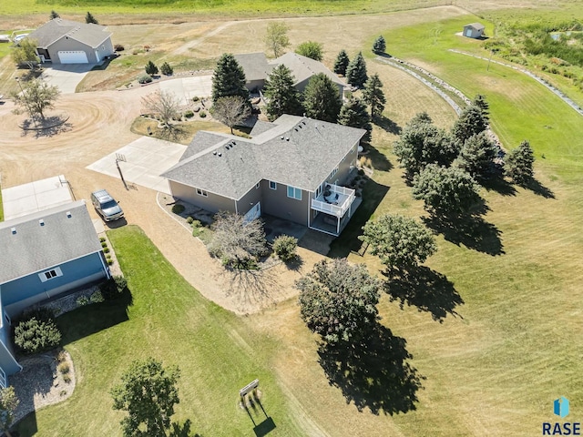 birds eye view of property with a rural view