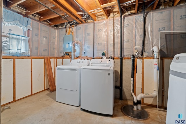 clothes washing area featuring electric panel and washing machine and clothes dryer