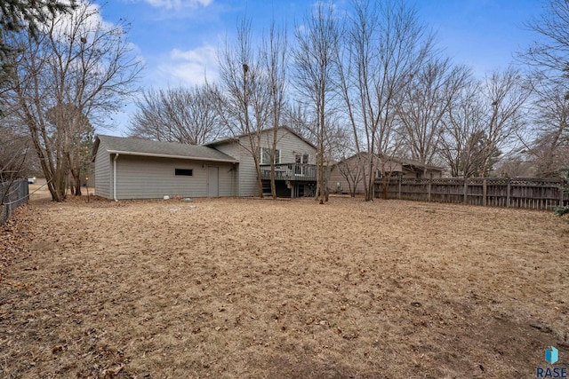 back of property featuring a wooden deck