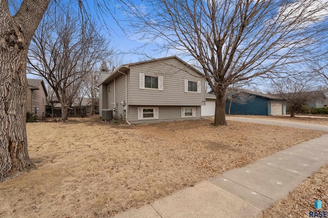 split level home featuring a garage and central AC