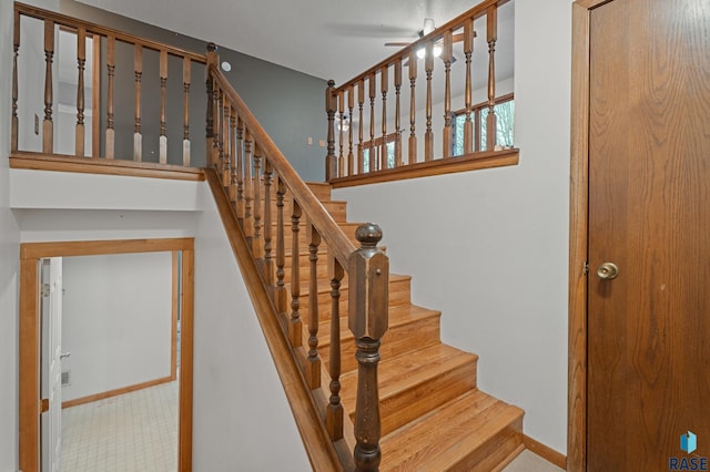 stairway with ceiling fan