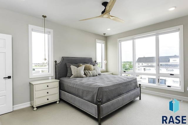 bedroom with ceiling fan and carpet flooring