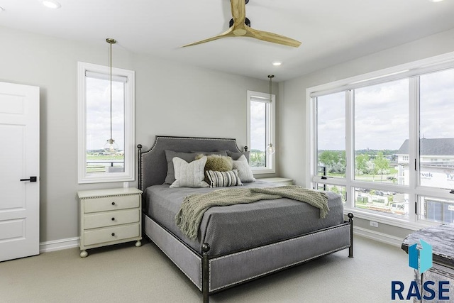 carpeted bedroom featuring ceiling fan