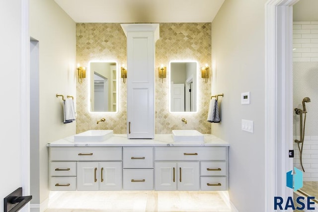 bathroom featuring vanity and decorative columns