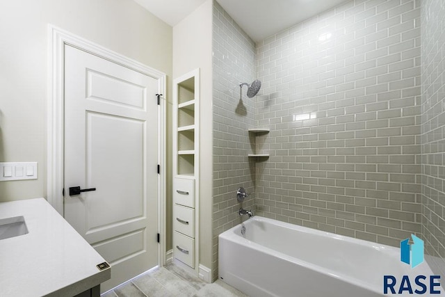 bathroom with vanity and tiled shower / bath combo