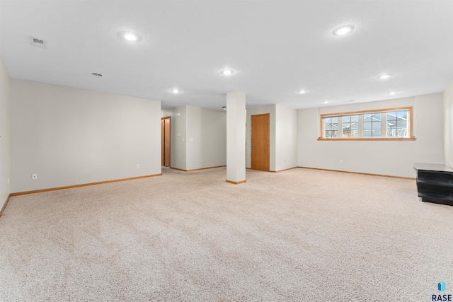 basement featuring light colored carpet