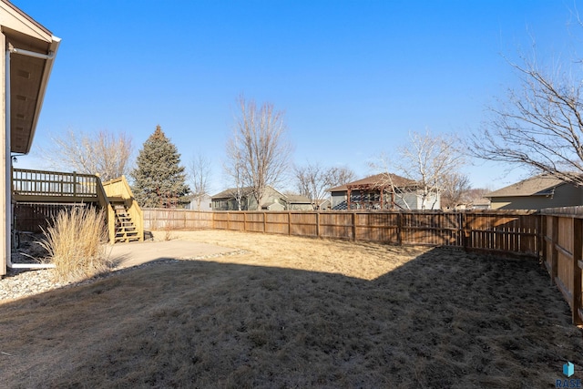 view of yard with a wooden deck