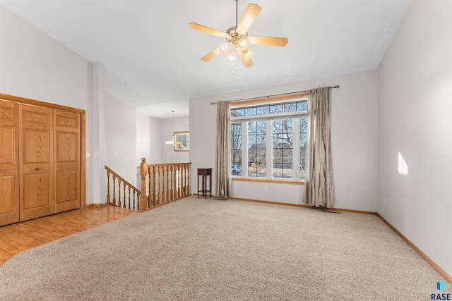 unfurnished room featuring ceiling fan and carpet floors