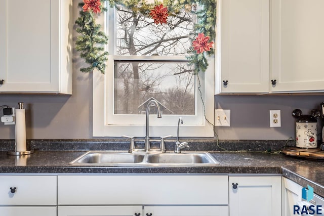 kitchen with sink and white cabinets