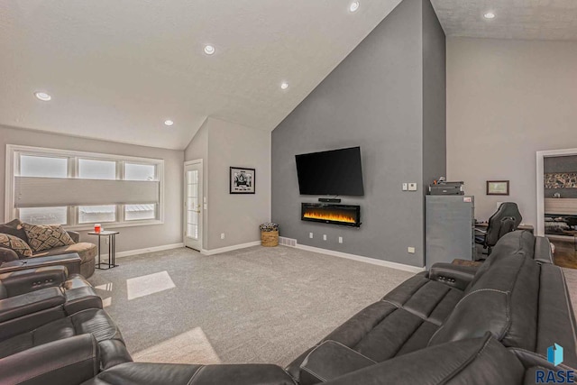 living room with high vaulted ceiling and carpet