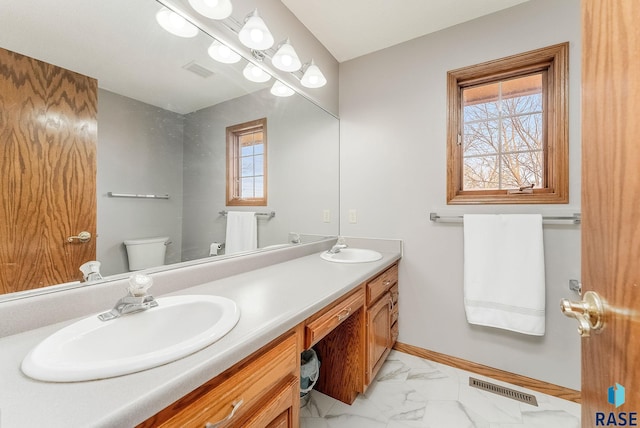 bathroom with vanity and toilet