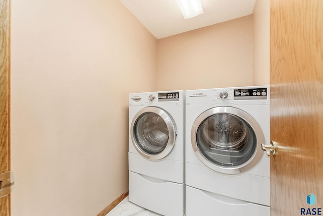 laundry area with washer and clothes dryer