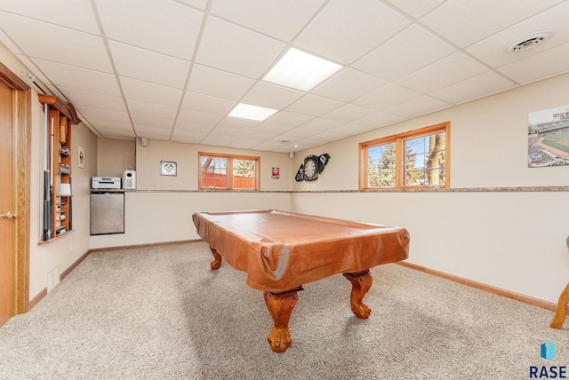 playroom featuring a drop ceiling and carpet floors