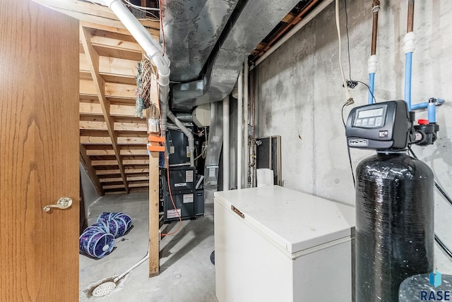 utility room featuring heating unit