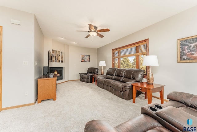 living room featuring light carpet and ceiling fan