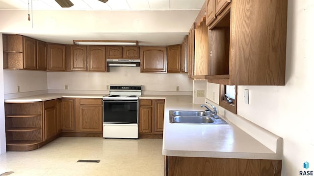 kitchen featuring white electric stove and sink