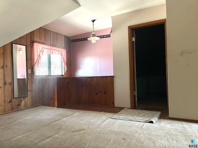 empty room featuring wooden walls