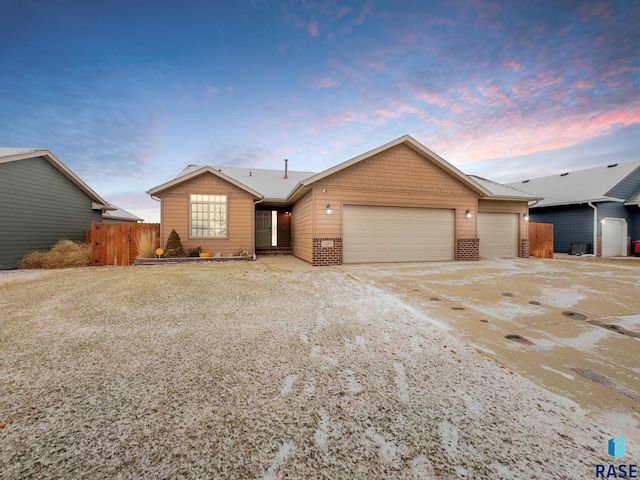 single story home with a garage