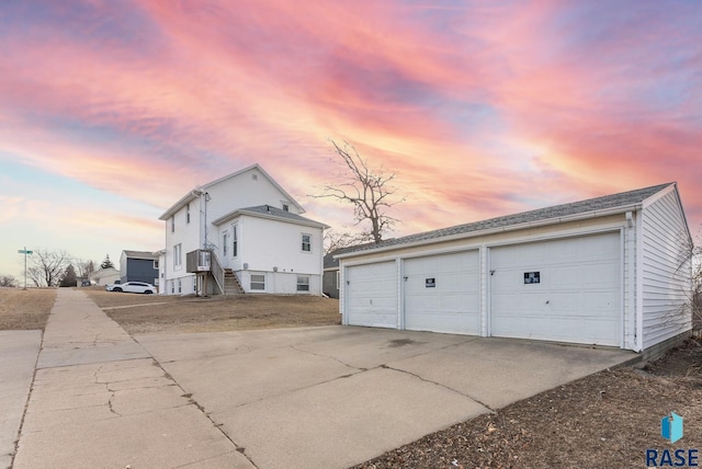 exterior space with an outbuilding and a garage